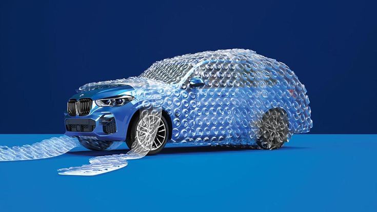 Blue BMW wrapped in bubble wrap